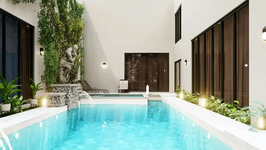 A clean blue pool surrounded by trees